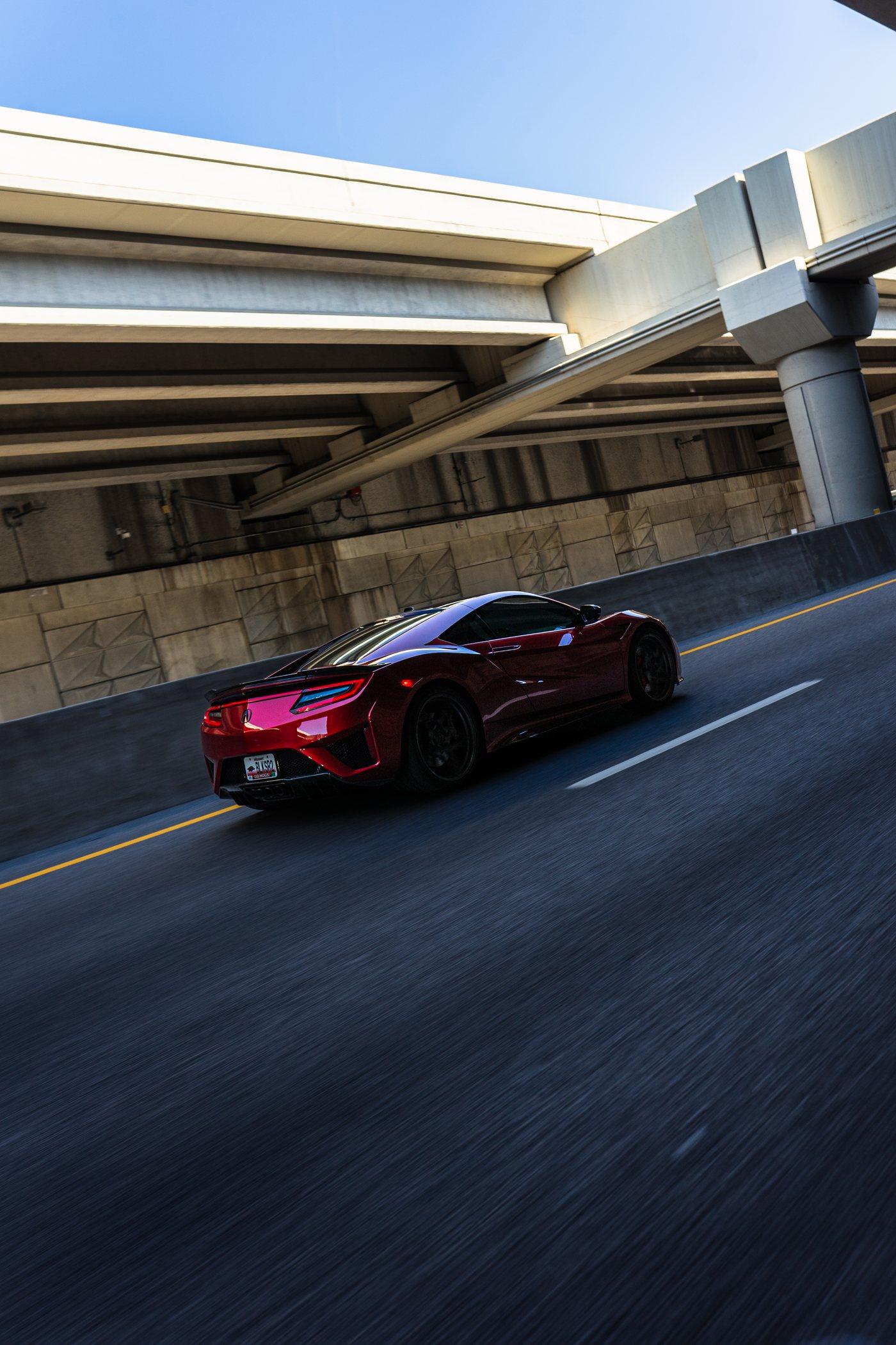 Red Acura NSX photographed on the road